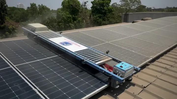 Solar Glide robot on a rooftop panel row, seen from above