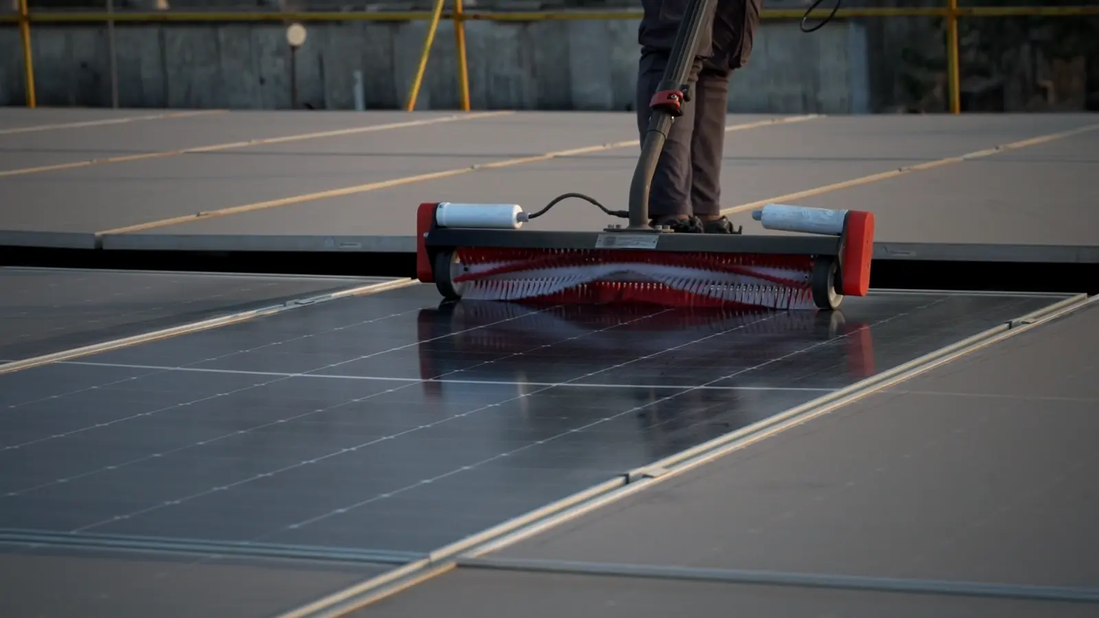 Aqualess Industrial cleaner moving across a rooftop solar panel