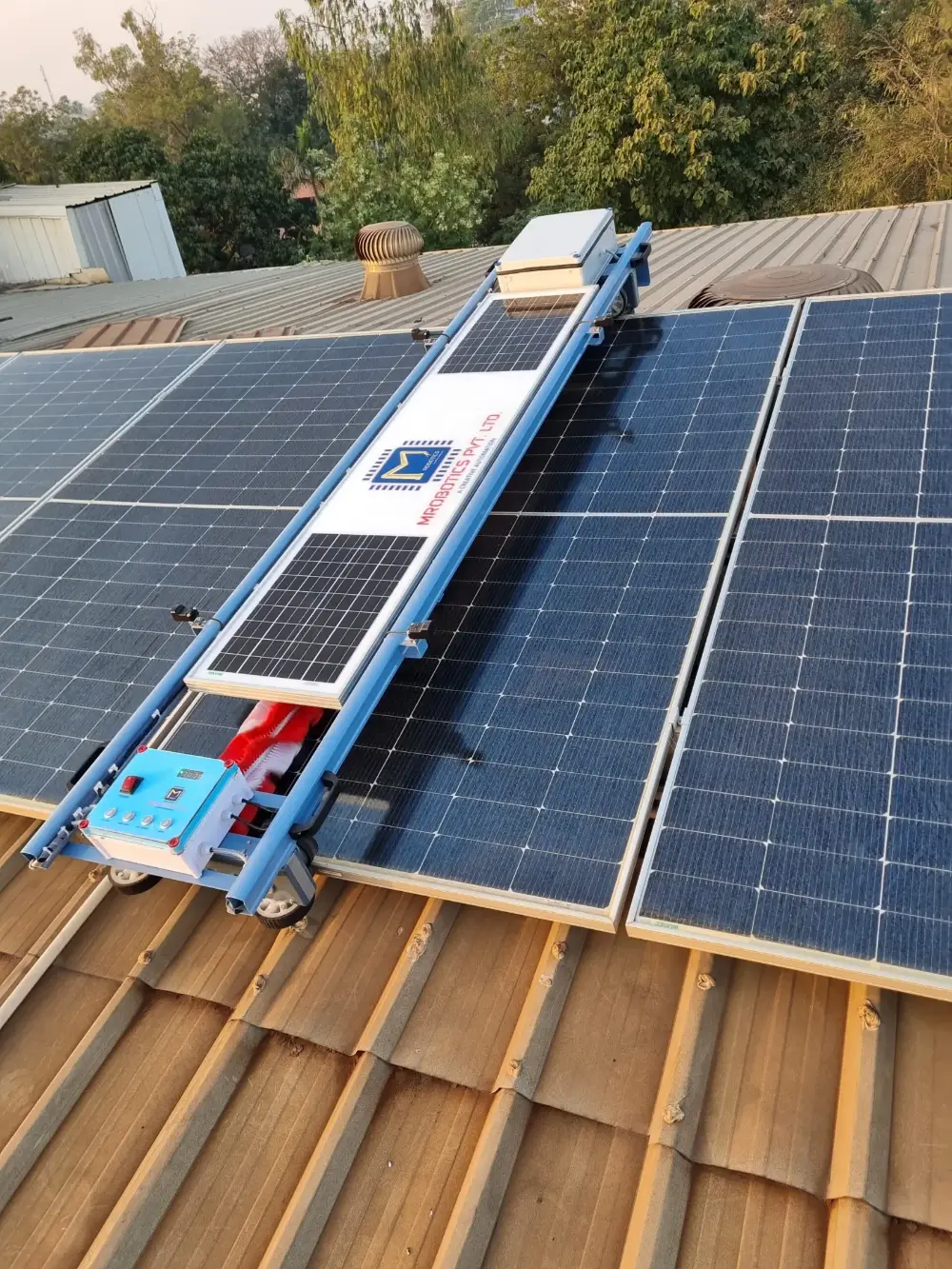 Solar Glide robot fitted across a row of solar panels